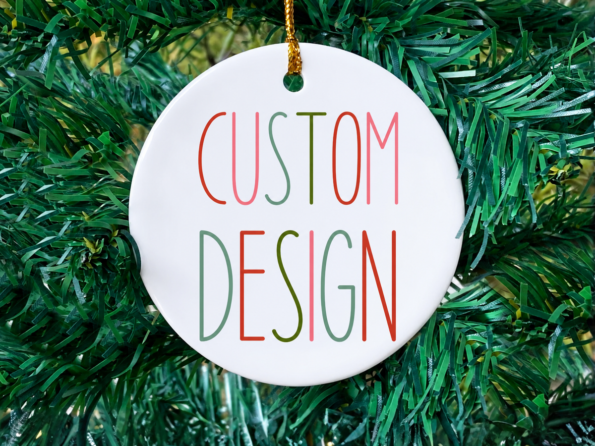 Custom text on a round white ceramic ornament with a gold hanging string